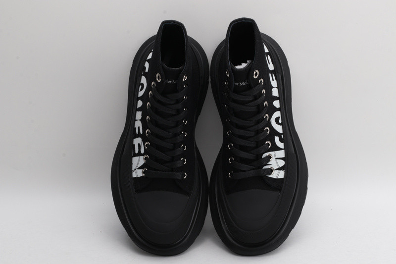 alex mcq tread slick boot in black with letters